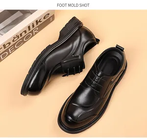 Top-down view of men's black genuine cowhide leather business shoes with thick soles