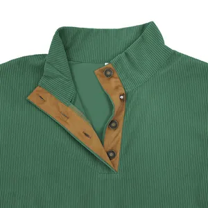 Close-up of green corduroy stand collar sweatshirt with 4-button brown placket