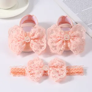 Pink baby princess shoes and lace bow headband set featuring elegant pearl details