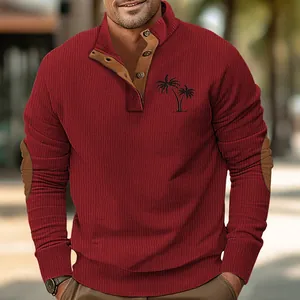 Close-up of men's burgundy ribbed sweatshirt with palm tree print and button neck