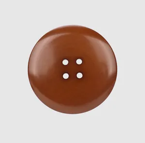 A detailed view of a classic brown four-hole resin button perfect for high-end apparel.