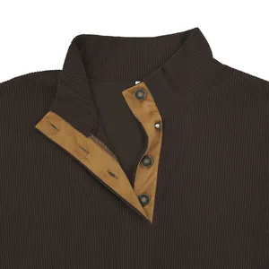 Detailed macro view of brown corduroy sweatshirt collar featuring a tan four-button placket