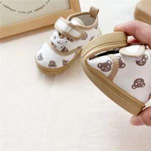 Detail view showing the flexible soft sole of bear print canvas shoes for kids