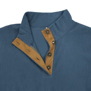 Close-up detail of vintage blue corduroy sweatshirt featuring a buttoned stand collar placket