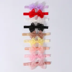 Set de nueve diademas coloridas para bebé con lazos de tul con lunares en tonos pastel suaves