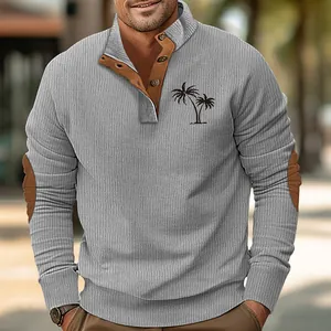 Detail showing men's ribbed stand collar sweatshirt with palm tree print and brown elbow patches