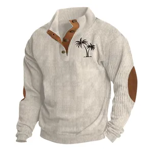 Close-up of men's ribbed corduroy sweatshirt with palm tree print and button collar