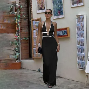 Elegant black halter knit maxi dress featuring white contrast trim and deep V-neckline