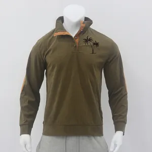 Detail view of men's olive green corduroy sweatshirt with black palm tree print