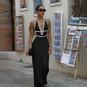 Elegant backless black knit maxi dress with contrasting white halter neck trim detail