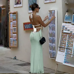 Backless halter knit maxi dress in green and white with elegant tie-up back details