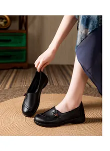 Elegant traditional black soft sole shoes for elderly women with ethnic decorative button