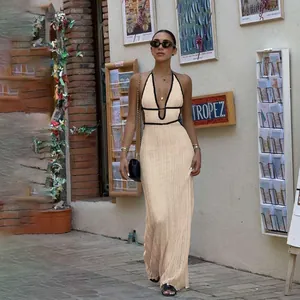 Chic contrast trim V-neck halter knitted maxi dress shown in a stylish European street setting