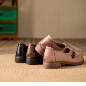 Detail view of comfortable leather flat shoes for elderly women in multiple colors.