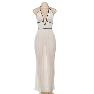 Front view of white knitted halter maxi dress with elegant black contrast piping detail