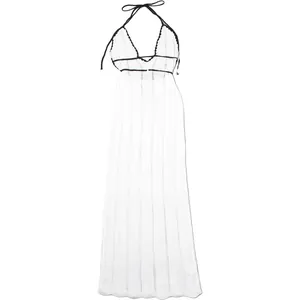 Elegant white knitted halter maxi dress featuring chic black contrast trim and tie-back.