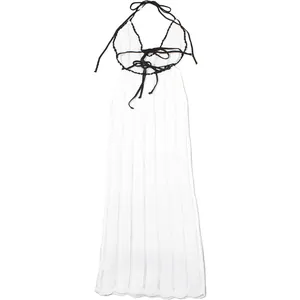 Detail view of the intricate knit pattern on this white halter neck maxi dress
