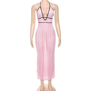 Elegant pink knitted halter dress featuring deep V-neck and black contrast trim
