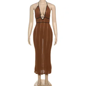 Close-up of brown halter neck knit maxi dress with deep V-neck and black lace trim