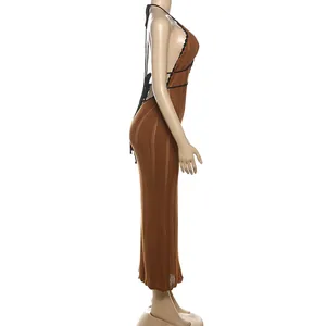 Side view of a brown knit halter maxi dress featuring a backless design and contrast trim