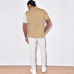 Back view of men's color-block corduroy casual shirt and pants set in tan and white