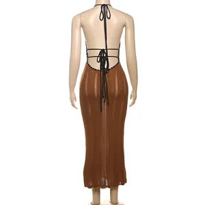 Detail view showing the back of a brown halter knitted dress with black tie straps