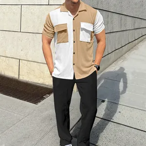 Detailed macro view of the men's color-block corduroy shirt and black pants set.