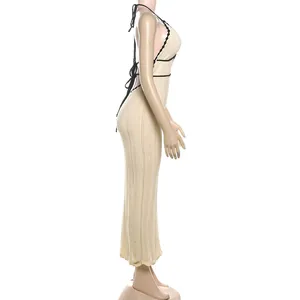 Detailed side view of a knit halter backless maxi dress featuring black contrast trim