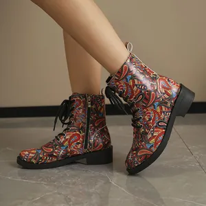Women's western style Martin boots with colorful paisley floral print and flat heel