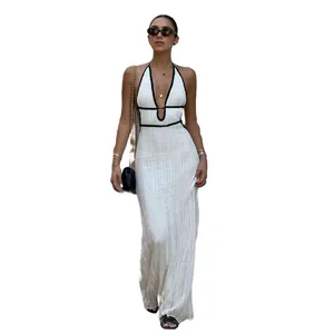Stylish white knit halter maxi dress with contrast black trim and backless design