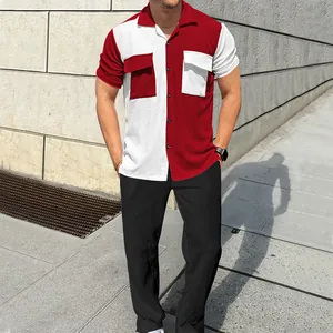 Full view of men's red and white color-block corduroy shirt and black pants set on model