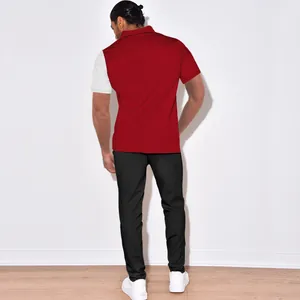Back view of men's red and white colorblock corduroy polo shirt and black pants set
