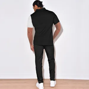 Back view of men's color-blocked corduroy leisure suit showing textured fabric and fit