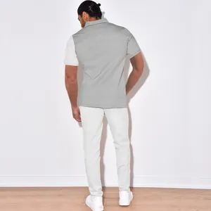 Back view of a casual two-piece corduroy set for men with a stylish color-block design.