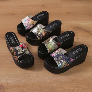 Collection of floral print wedge platform slippers for women featuring thick black soles