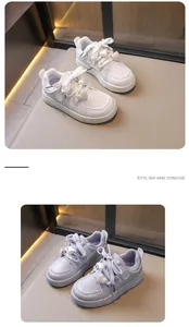 Close-up detail of stylish children's board shoes with cute heart-shaped charms.