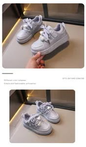 Macro view showing the detailed design and heart charms of stylish girls' sneakers