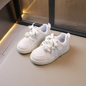Stylish white sneakers for girls with heart-shaped pearl charms for the school season