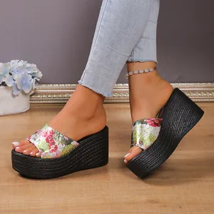 Detailed macro view of vibrant floral pattern wedge platform sandals for women in a studio