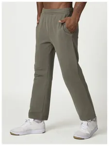 Detailed side view of men's olive green relaxed fit sweatpants with elastic drawstring waist