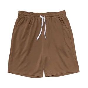 Macro view of brown casual sports shorts featuring white drawstring and elastic