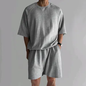 Detail view of men's casual grey t-shirt and shorts lounge set for summer wear