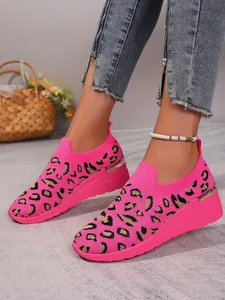Women's bright pink leopard print mesh slip-ons with wedge sole for casual wear