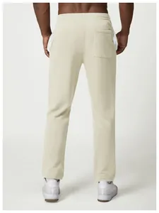 Detailed back view of men's beige loose sweatpants featuring white side stripes.