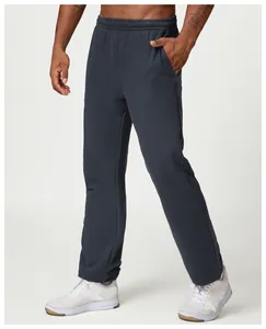 Detail view showing the relaxed fit and soft fabric of these men's navy sweatpants.