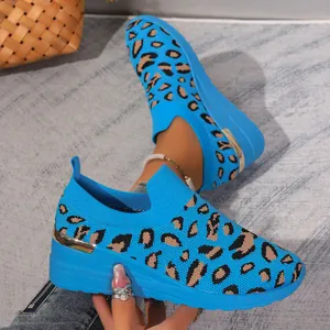Macro view of blue leopard print fly-woven slip-on wedge sneakers for women fashion