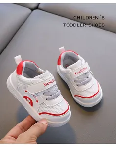 Close-up view of white and red toddler walking shoes with breathable mesh and velcro