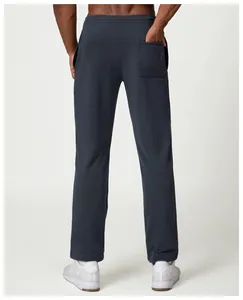 Detailed back view of men's loose-fit charcoal grey sweatpants for casual citywalk
