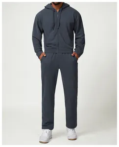 Professional studio shot of loose charcoal grey men's casual joggers and matching hoodie