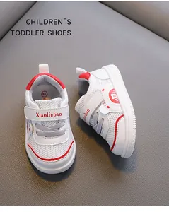Close-up of breathable toddler sports shoes featuring mesh fabric and red details.